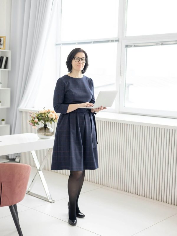 a-young-woman-in-glasses-and-in-a-blue-shirt-works-at-home-at-a-laptop-as-a-coach.jpg