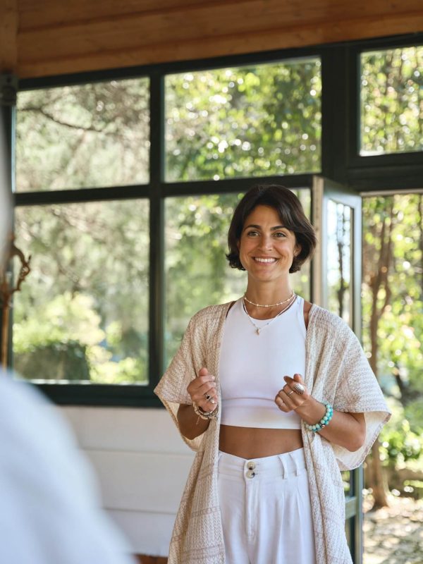 young-happy-woman-yoga-coach-training-people-group-talking-at-holistic-session-.jpg